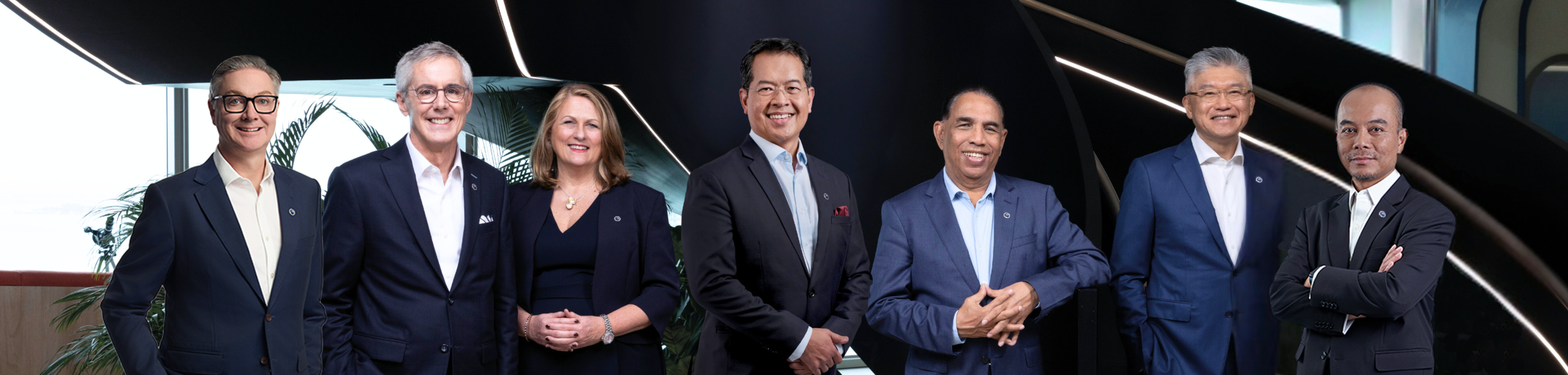 Close-up of a person's hands holding a compass and measuring on a nautical map